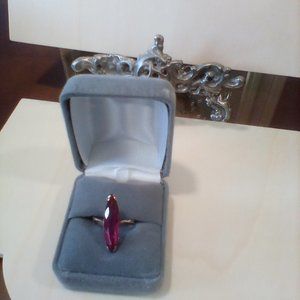 Rare vintage pigeons blood oblong marquise ruby ring. Set in 10k yellow gold.